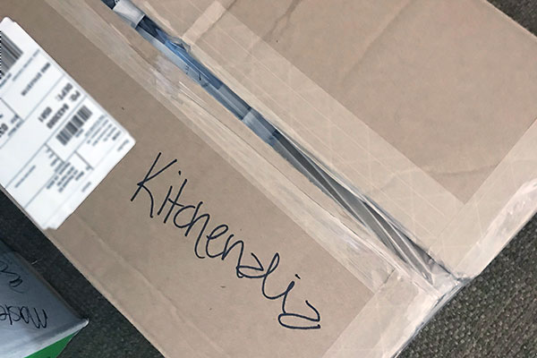 Moving box marked "kitchenalia"